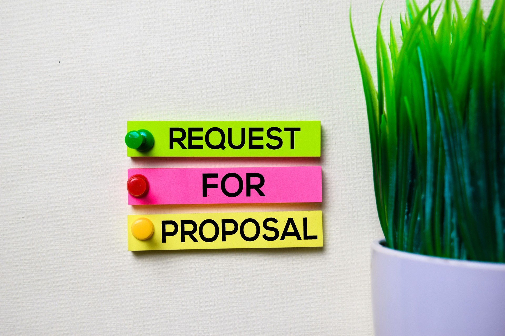 Request For Proposal text on sticky notes isolated on office desk